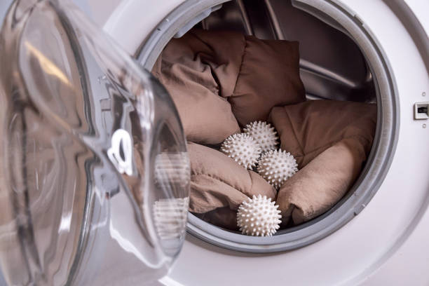 istock the laundry balls and the down jacket are in the washing machine 2200432593
