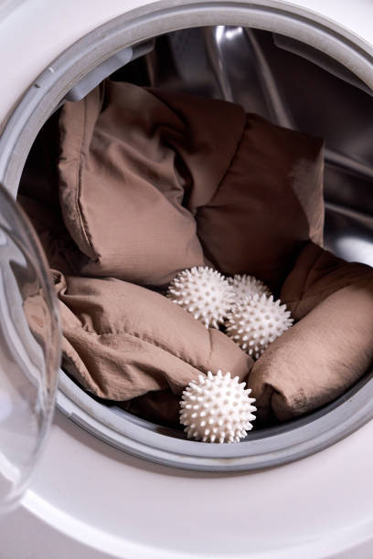 istock the laundry balls and the down jacket are in the washing machine 2200432630