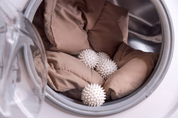 the laundry balls and the down jacket are in the washing machine