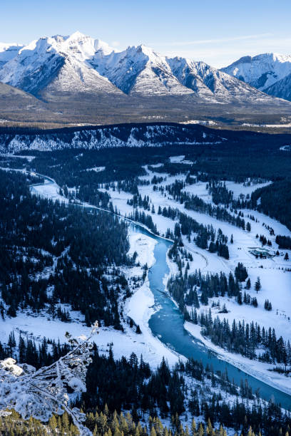 istock Winter river flowing through snow covered mountains in Banff National Park 2200433981