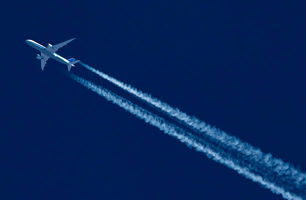 istock Commercial airliner with twin vapour trails 2200434004