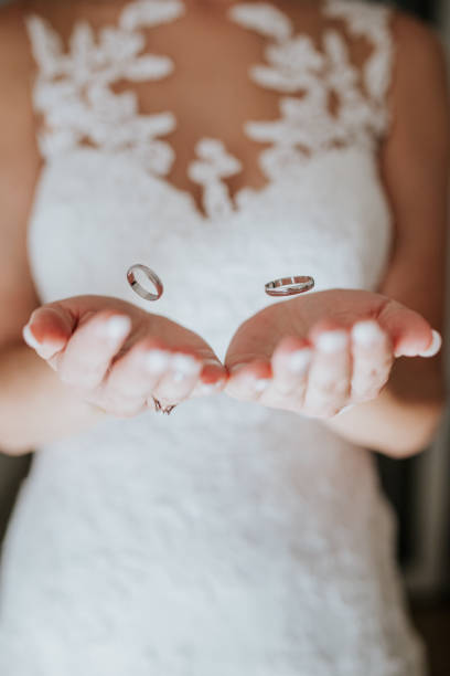 istock Floating Wedding Rings in Bride's Hands 2200437716