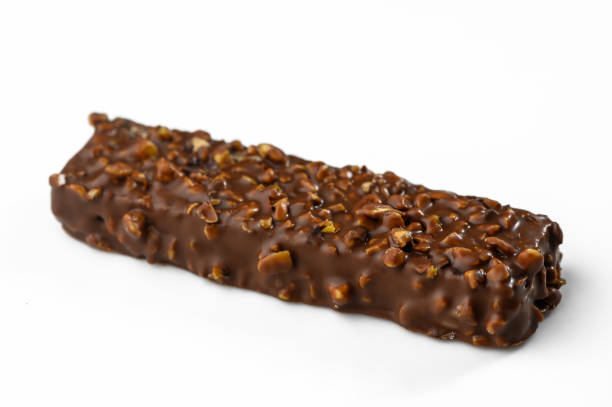 istock Decadent chocolate bar coated with crunchy nuts captures sweet indulgence in a simple setting 2200438587