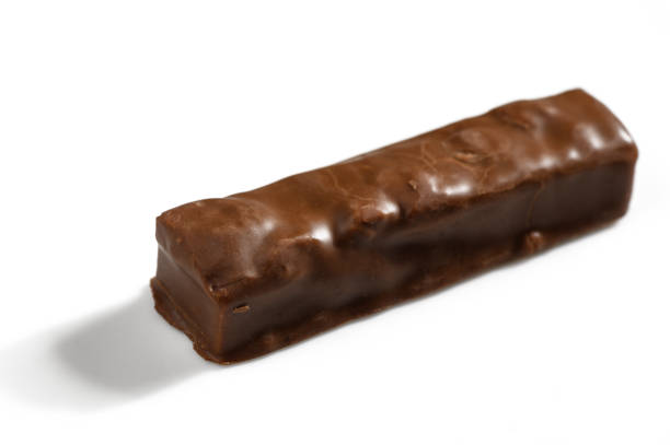 istock Chocolate confection with a smooth, glossy surface resting on a clean white backdrop 2200439363