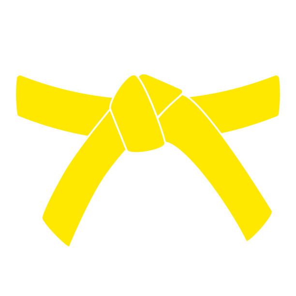 Yellow carate belt glyph icon A yellow karate belt glyph icon, representing martial arts, is depicted in a clean vector design. The isolated clipart symbol is perfect for illustrating martial arts achievements. yellow belt stock illustrations