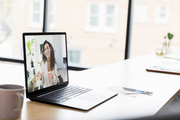 istock Virtual Meeting: Woman on Laptop Screen Discussing Ideas 2200446159