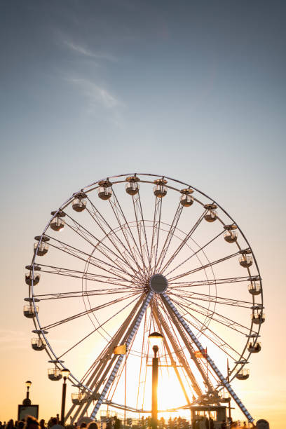 istock Ferris wheel at sunset in Biscarrose 2200446958