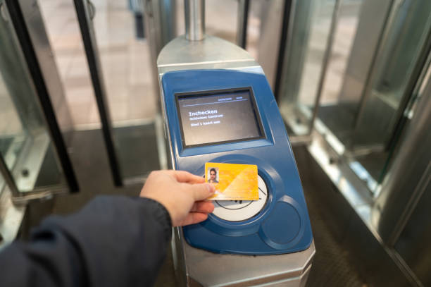istock Commuter using public transport card at subway station entrance 2200448147