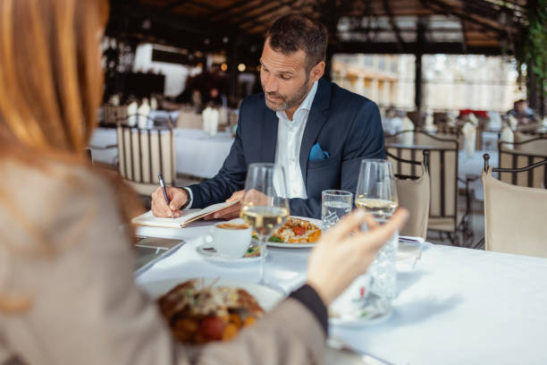 istock Entrepreneurs Discussing Startups Over Gourmet Dishes 2200452947