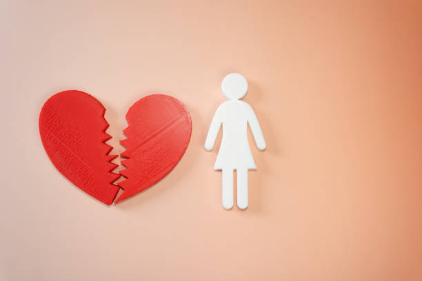 Concept of woman with a broken heart on biege background