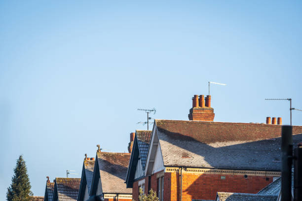 Frost snow covered british house roof in england uk.