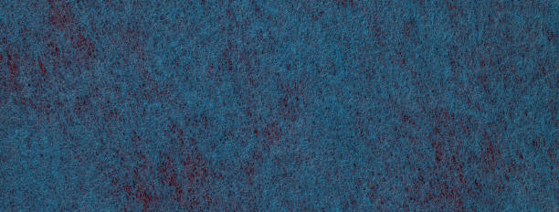 istock Texture navy blue and red color felt background with spots fabric macro. Structure denim textile 2200460942