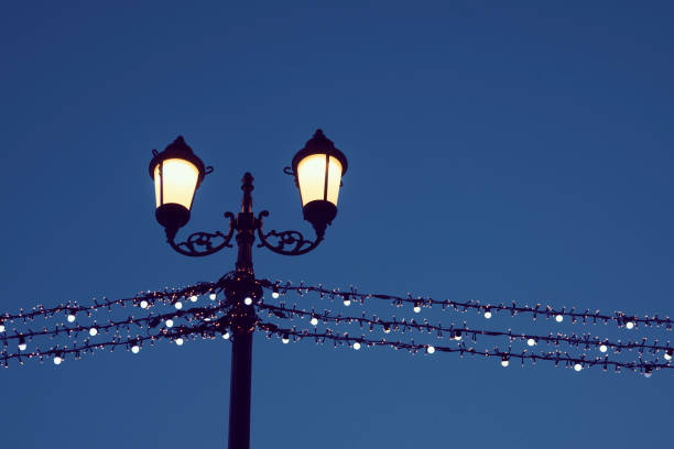 blue sky and yellow street light after sunset