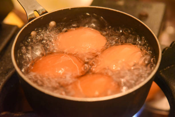 istock Close-up of eggs being cooked in boiling water, precision cooking, kitchen atmosphere, soft-boiled egg preparation 2200461629