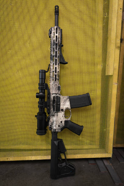 Tactical rifle with optical sight in a shooting range.