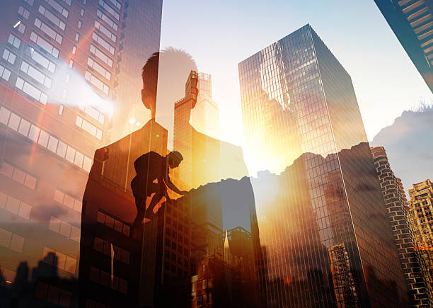 istock Following Path to Success, Visualizing Resilience and Strength Amid Challenges. Man Climbing Up a Mountain Facing City Feeling Empowered, Visualizing Resilience and Strength Amid Challenges 2200468068