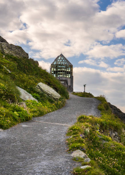 Swarovski Observatory located near snow capped peaks Austrias highest mountain-Grossglockner in Hohe Tauern National Park. High mountain structure amidst Alpine landscape
