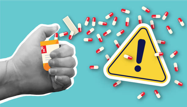 istock Collage style hand holding Prescription medication bottle with warning sign health concept 2200474760