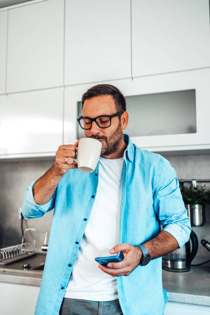 istock Portrait of a happy man using a mobile phone 2200475693