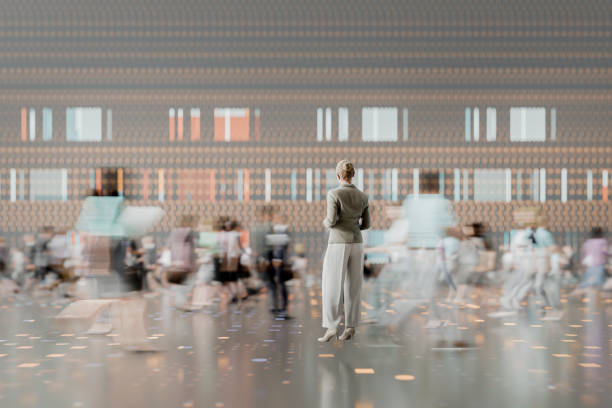 istock Businesswoman standing in futuristic VR environment 2200480876