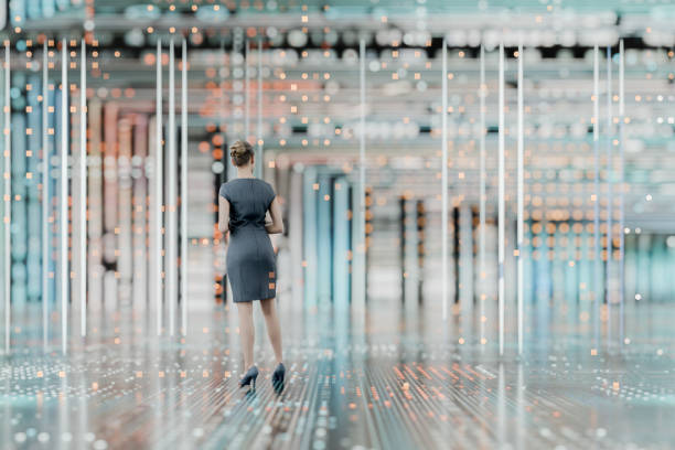 istock Businesswoman standing in futuristic VR environment 2200480890