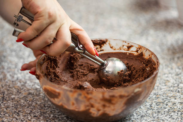 A woman preparing chocolate truffles in the kitchen