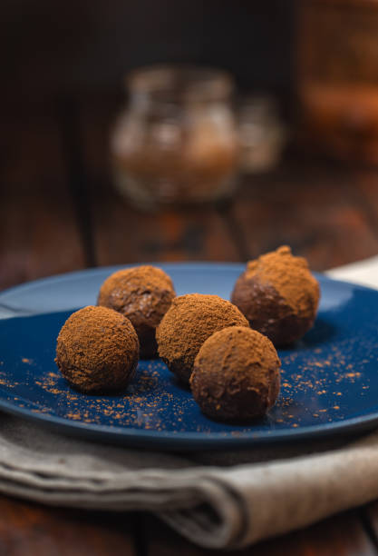 Delicious homemade chocolate truffles sprinkled with cocoa powder