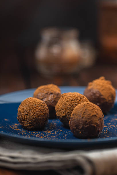 Delicious homemade chocolate truffles sprinkled with cocoa powder
