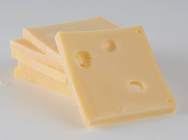 istock Cheese slices with holes placed on top of each other 2200484785
