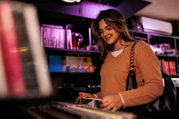 Young Woman Selecting Records at Vinyl Store