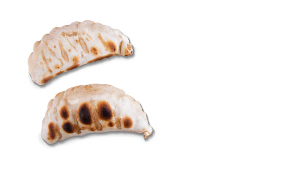 istock Argentine empanada stuffed with cheese, cooked on the grill. 2200485983