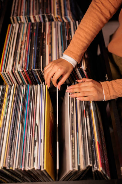 istock Young Woman Browsing Vinyl Records 2200486022