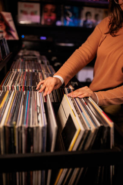istock Young Woman Browsing Vinyl Records 2200486032