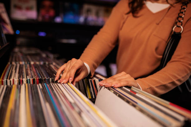 istock Young Woman Browsing Vinyl Records 2200486042
