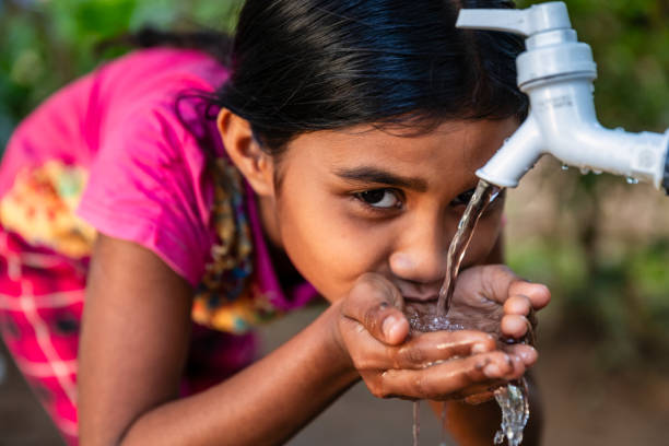 istock Sri Lankan young girl drinking a water, Ceylon 2200487259