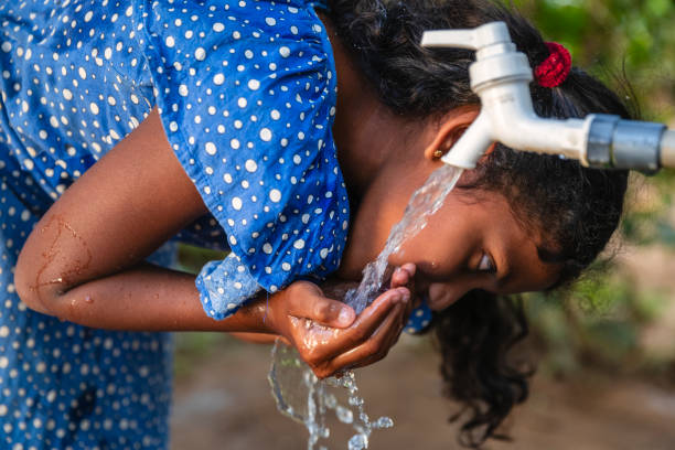 istock Sri Lankan young girl drinking a water, Ceylon 2200487407
