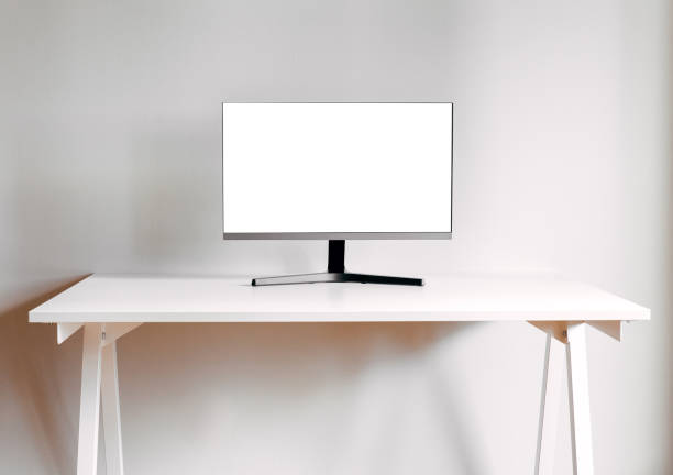 istock A black computer monitor on a white table. Mock up for design, teplate. Stylish minimalist interior. Gray background. 2200489988