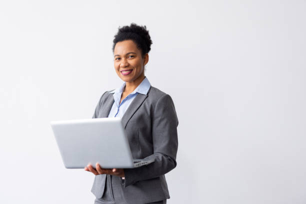 istock Skilled African American business leader balancing a laptop while working 2200490103