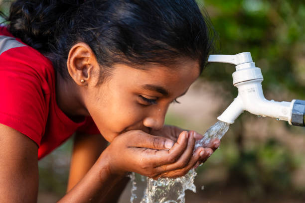 istock Sri Lankan young girl drinking a water, Ceylon 2200490432