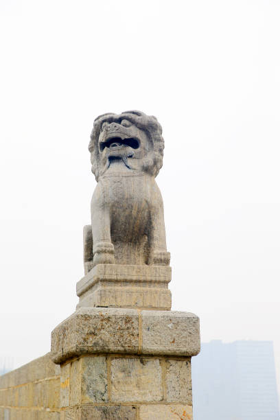 Montreal, Canada - July 5, 2024. Lion statue at Chinese Garden in Montreal Botanic Garden, Montreal, Quebec, Canada