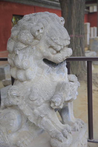 istock Stone lion carving craftsmanship in China 2200494902