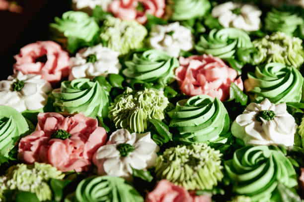 istock Cropped closeup of succulent wedding cupcake display 2200497443