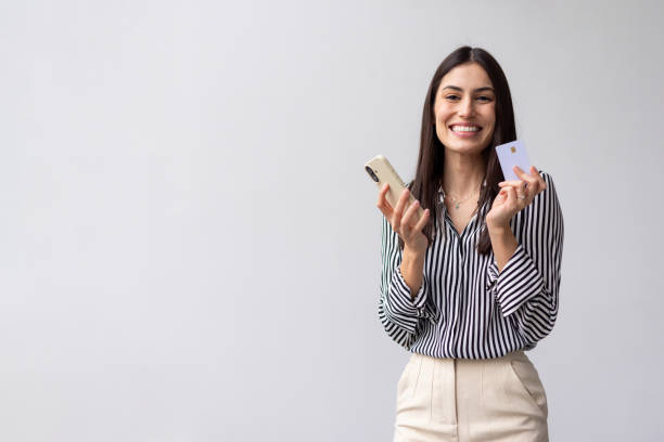istock Joyful Latina shopper finalizing an online transaction 2200500447
