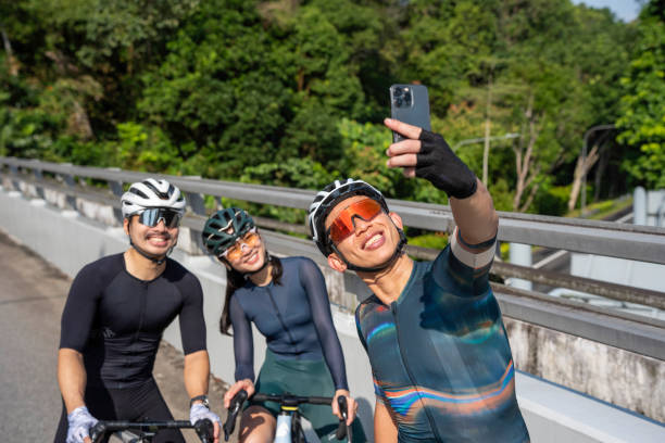 istock Cyclists in Singapore taking a selfie photo 2200500497