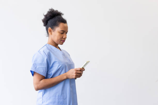istock African American nurse using a smartphone 2200500923