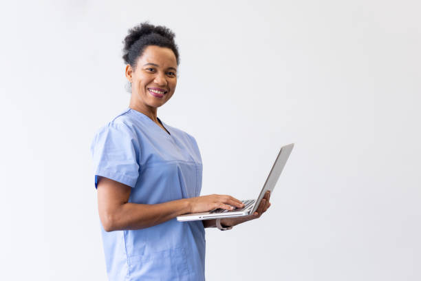 istock Efficient nurse handling medical tasks with a laptop in hand 2200502810