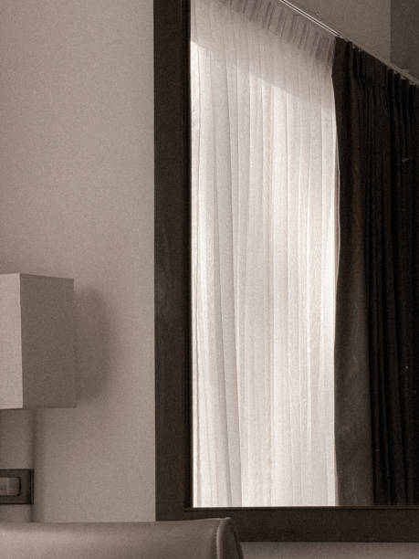 istock Hotel room with window, curtains, and soft lighting 2200503304