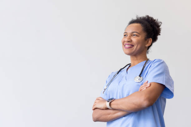 istock Smart African American nurse standing confidently 2200504213