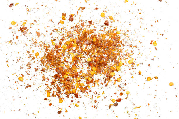 istock dried red chili pepper flakes and seeds isolated on white background 2200504941