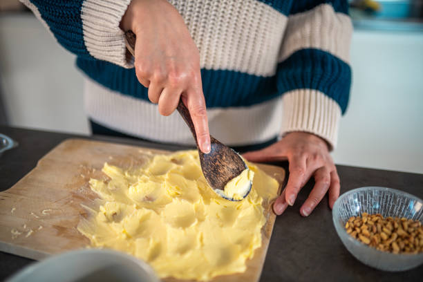 istock Mixed Race Woman Creating a Butter Board in Kitchen 2200506992